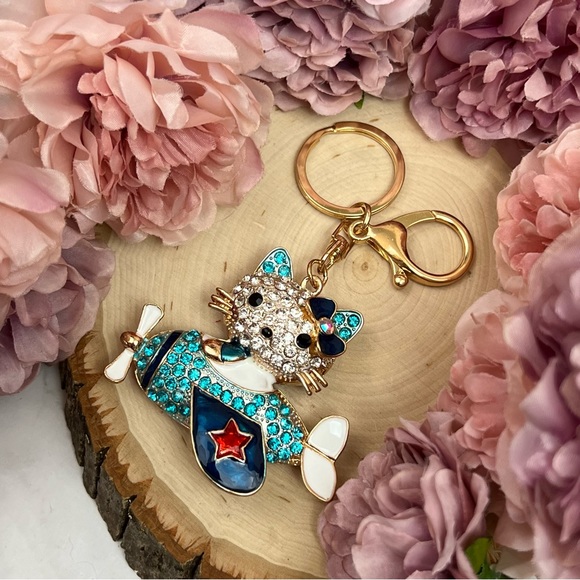 Hello Kitty Flying a Bkue Crystal Airplane Keychain Charm - Picture 10 of 16